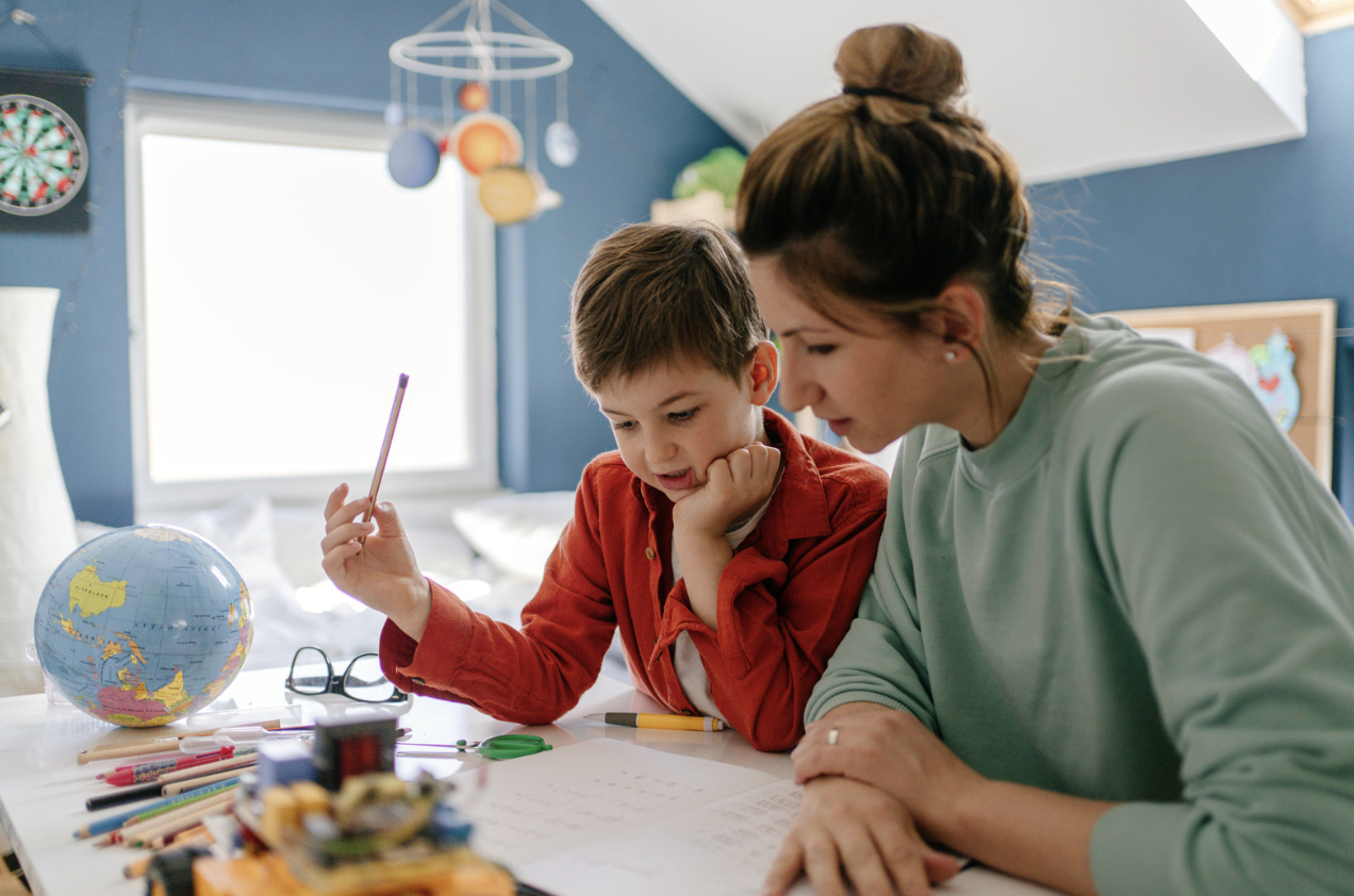 Parent and child working together during home learning